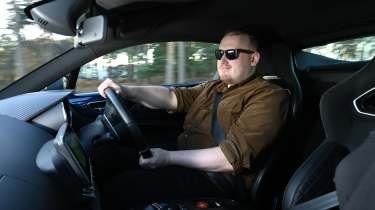 Auto Express news reporter Ellis Hyde driving an Alpine A110